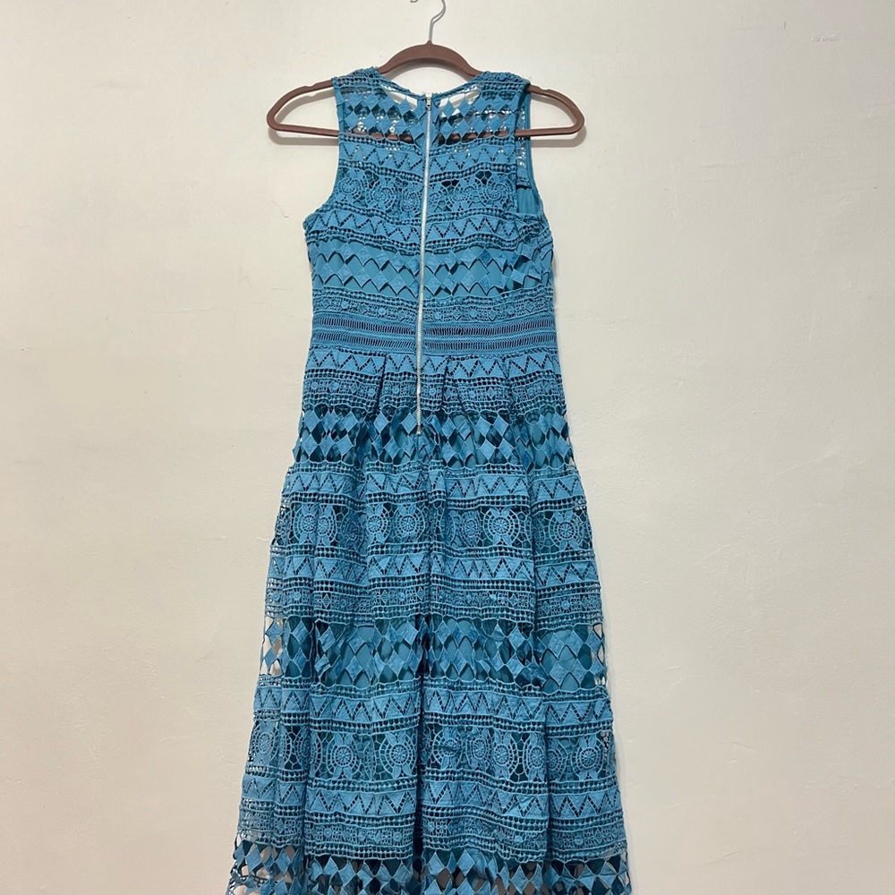 This is a cute aqua dress. If you are size 4 it would fit perfectly.
